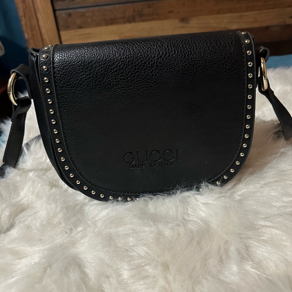 Gucci used bag. I bought at a garage sale. In fair condition.